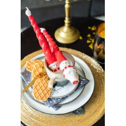 Long wax candles with Santa Claus motifs